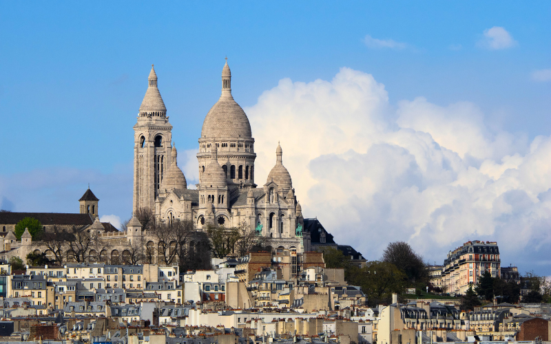 Breathtaking Views From The Top Of Montmartre, With Sacré Cœur Shining Brightly