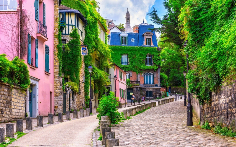 Montmartre In Paris, Where Cobblestone Streets Reflect A Rich Artistic Past